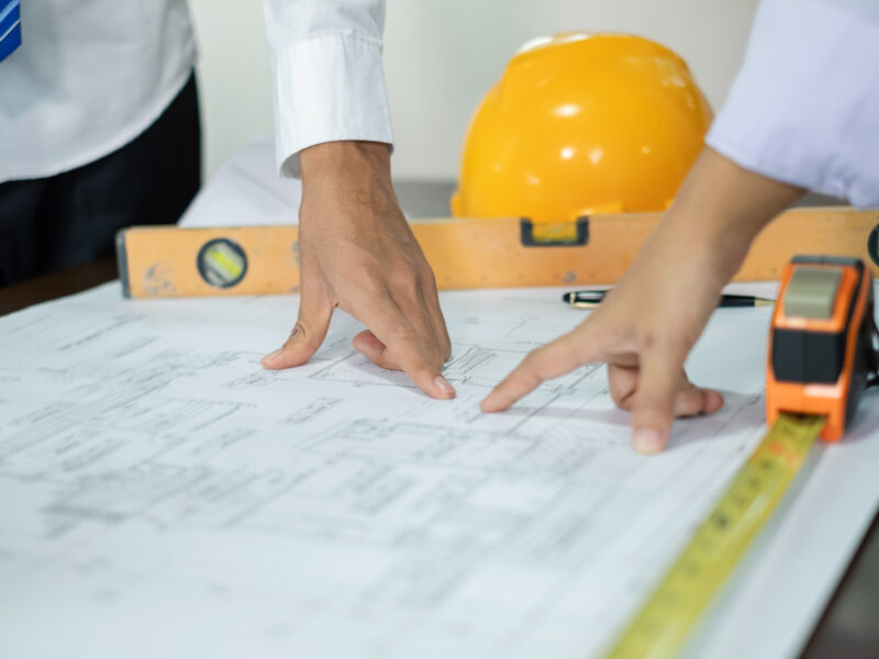 Team of male and female engineers and architects, working meetin